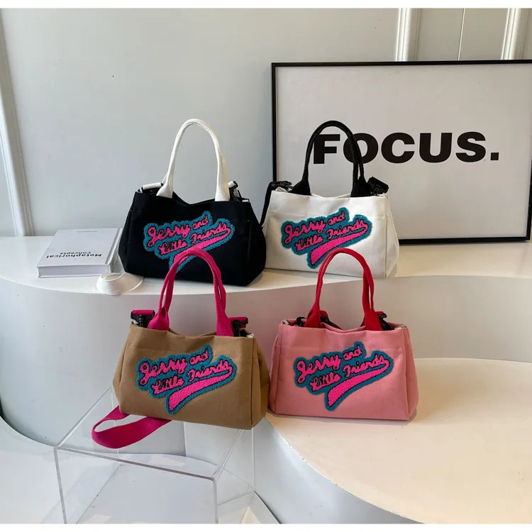 Letters hit color canvas bag pillow womens bag trend fashion shoulder wide shoulder strap cross bag 241111