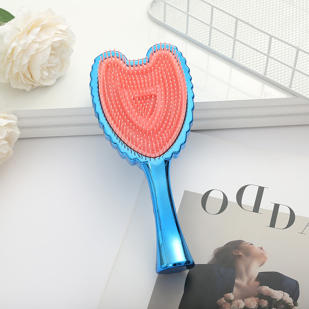 Trendy Minimalistic Hair Brush Featuring Angel Wings - Elegant Solid Colored Combing Tool for Ladies