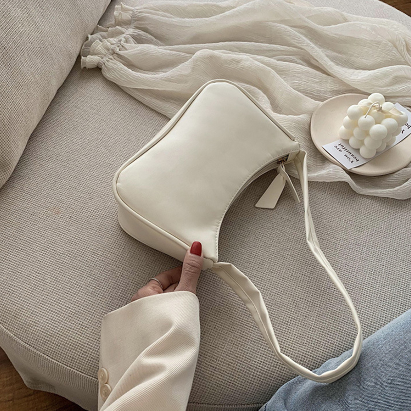 Retro forearm bag women's bow handbag PU leather baguette bag Western style single shoulder minimalist