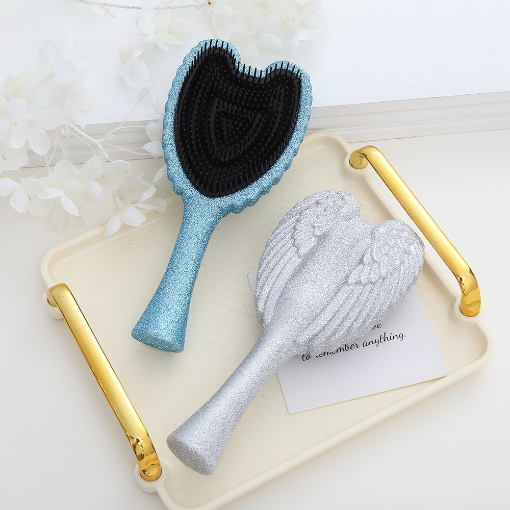 Portable Angel Wing Hair Comb Chic and Functional Handheld Grooming Device