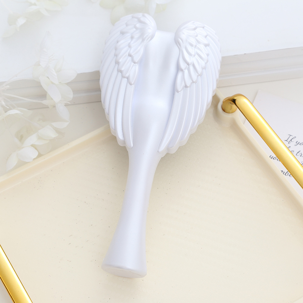 Chic Angel Wing Hair Brush Sleek and Convenient Combing Tool for Everyday Care