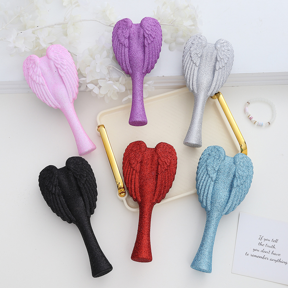 Portable Angel Wing Hair Comb Chic and Functional Handheld Grooming Device