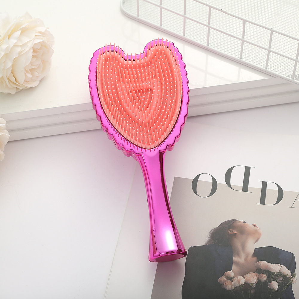 Trendy Minimalistic Hair Brush Featuring Angel Wings - Elegant Solid Colored Combing Tool for Ladies