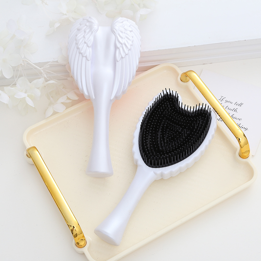Chic Angel Wing Hair Brush Sleek and Convenient Combing Tool for Everyday Care