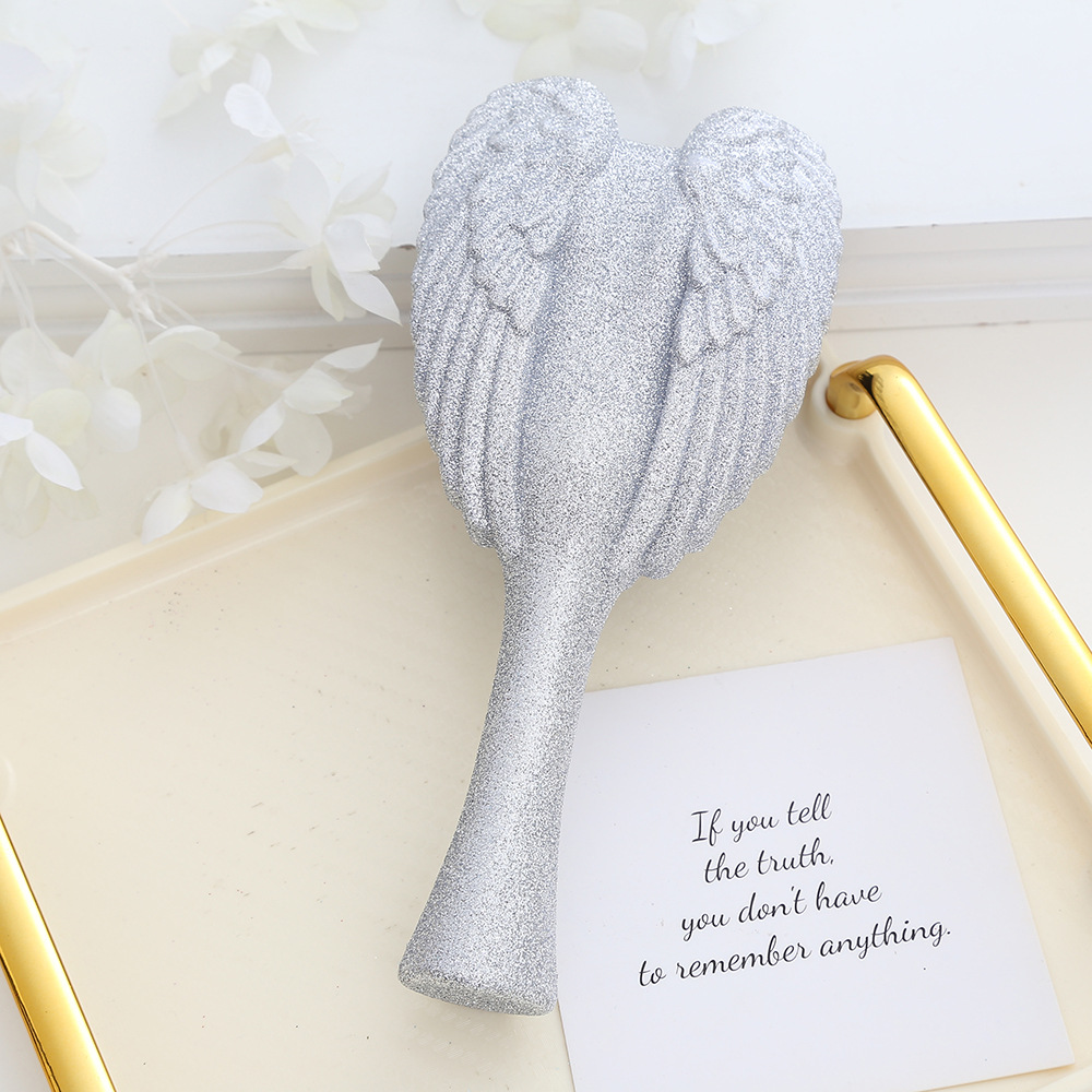 Portable Angel Wing Hair Comb Chic and Functional Handheld Grooming Device