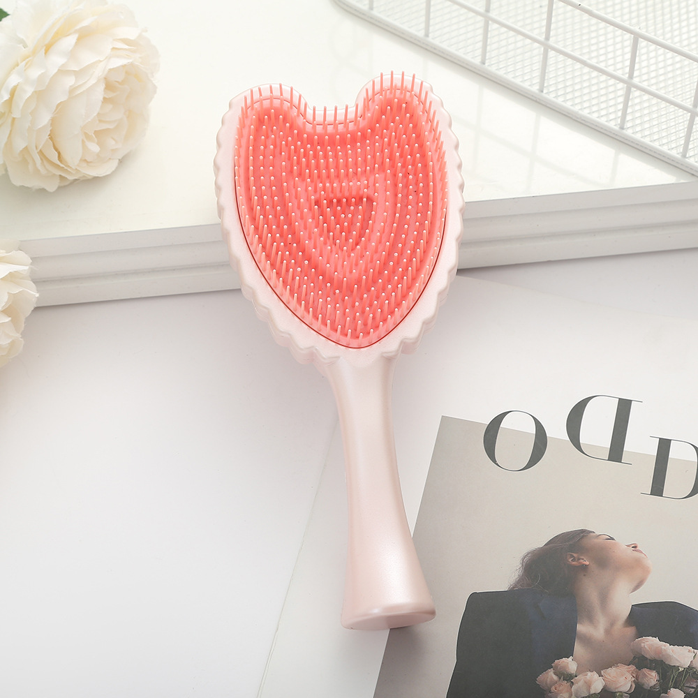 Trendy Minimalistic Hair Brush Featuring Angel Wings - Elegant Solid Colored Combing Tool for Ladies