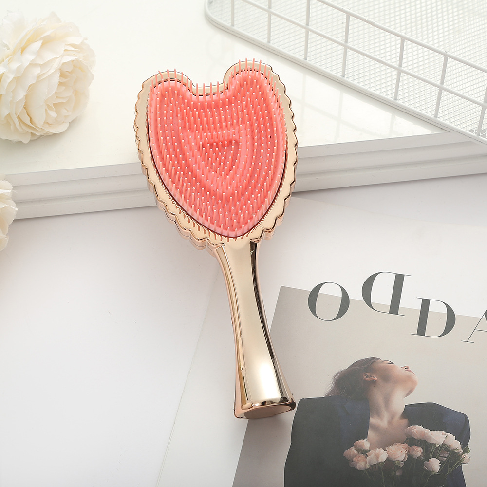Trendy Minimalistic Hair Brush Featuring Angel Wings - Elegant Solid Colored Combing Tool for Ladies