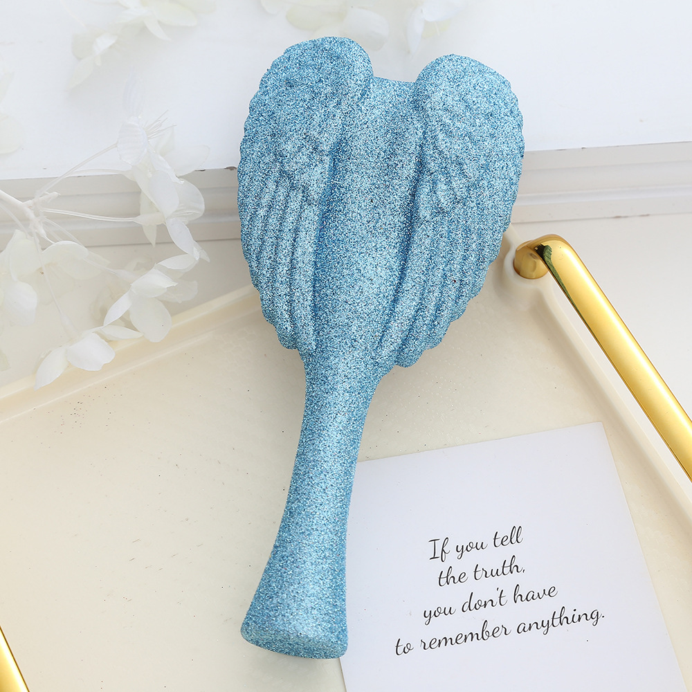 Portable Angel Wing Hair Comb Chic and Functional Handheld Grooming Device
