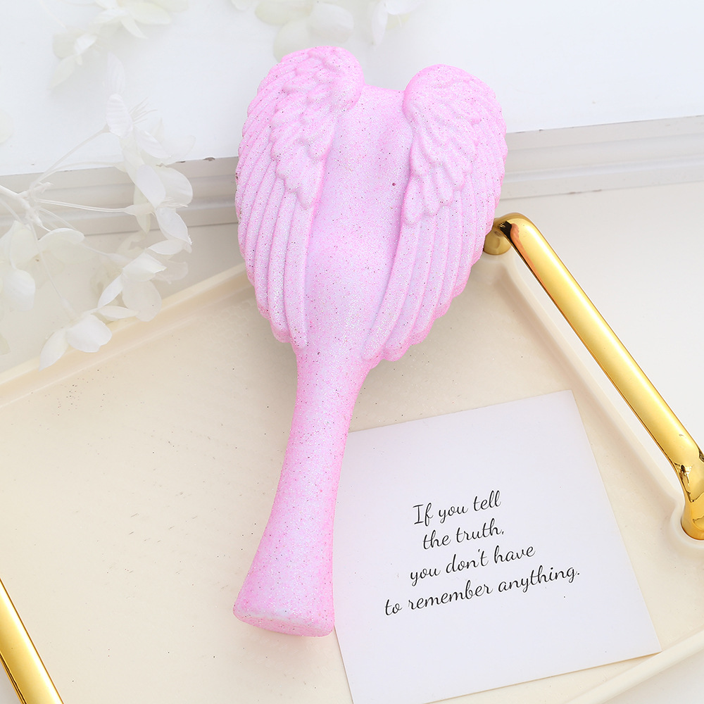 Portable Angel Wing Hair Comb Chic and Functional Handheld Grooming Device