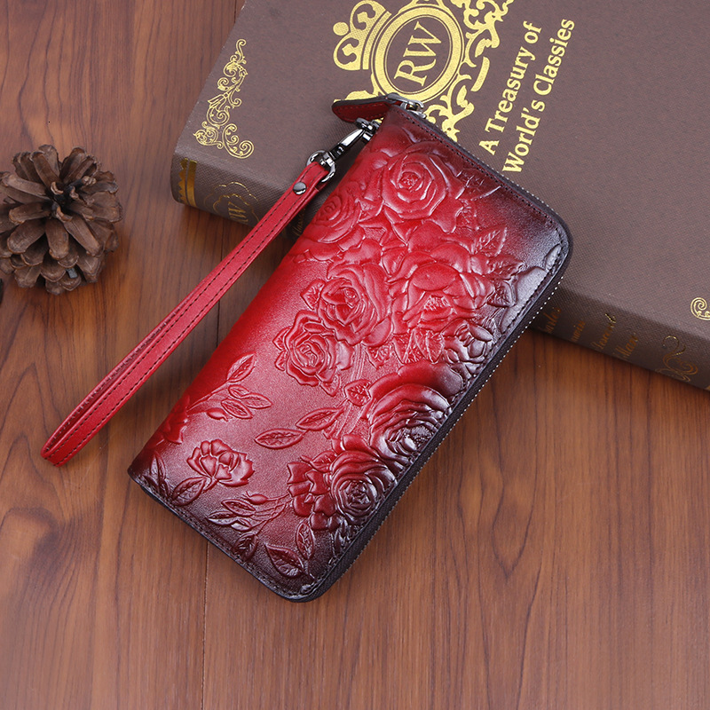 Designer's new cowhide style long women's handbag with fashionable multi slot embossed color zipper bag