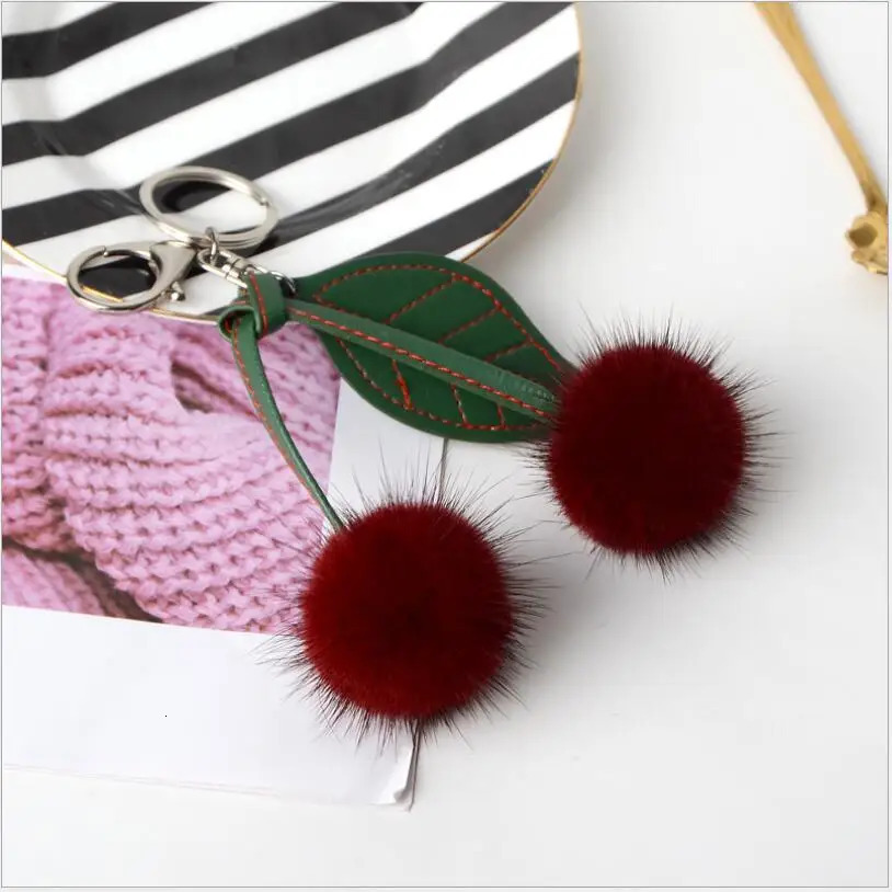 Genuine leather mink keychain fruit cherry puffball fur bag charming fluffy green leaf backpack pendant accessories 241115