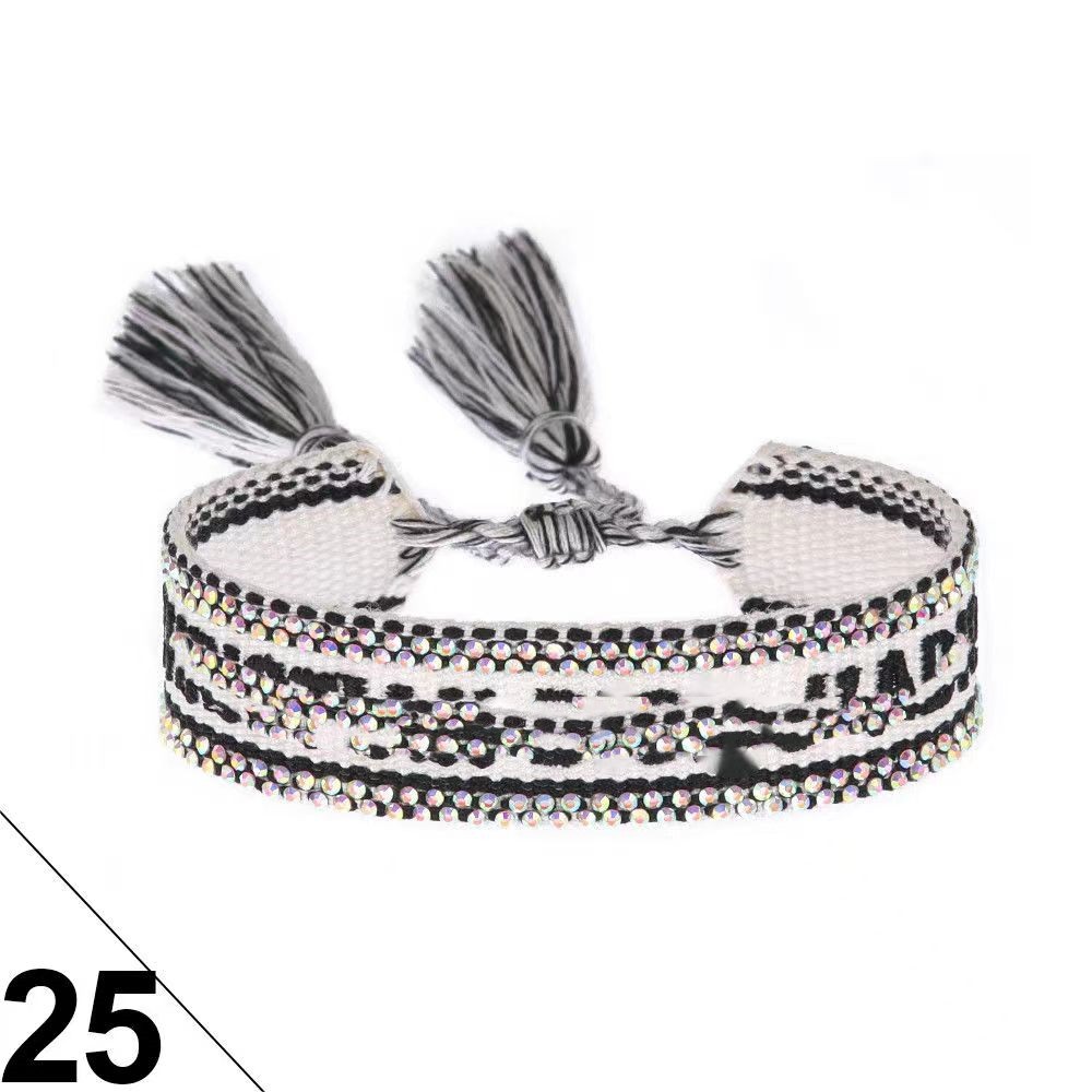 Customized high-value antique style retro wave hot stamping hand woven letter bracelet with rhinestones and trendy tassels