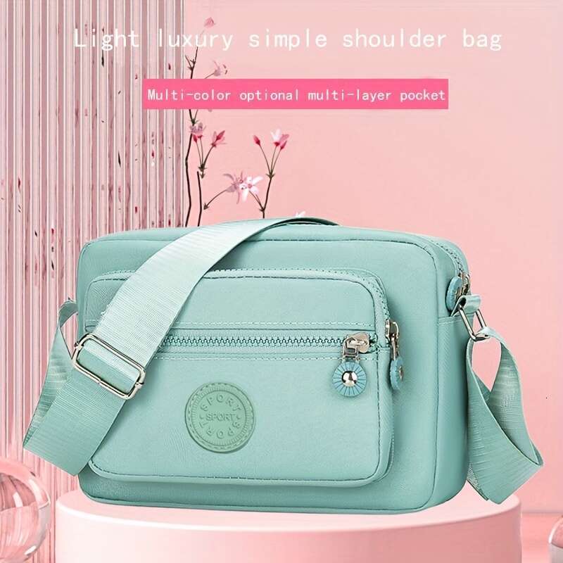 Chic Lightweight Nylon Crossbody Bag for Women - Adjustable Strap, Solid Color with Tassel Accent, Zip Closure