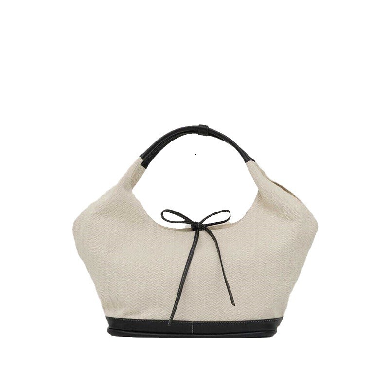 Designer's niche black white patchwork canvas tote bag, fashionable new style, large capacity and versatile commuting handbag, shoulder bag for w