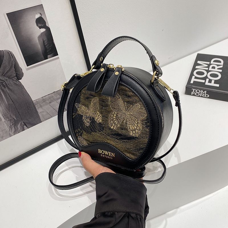 New high end Chinese style crossbody bag with trend multiple functions suitable for commuting Handheld designer small round leisure bag shoulder bag c