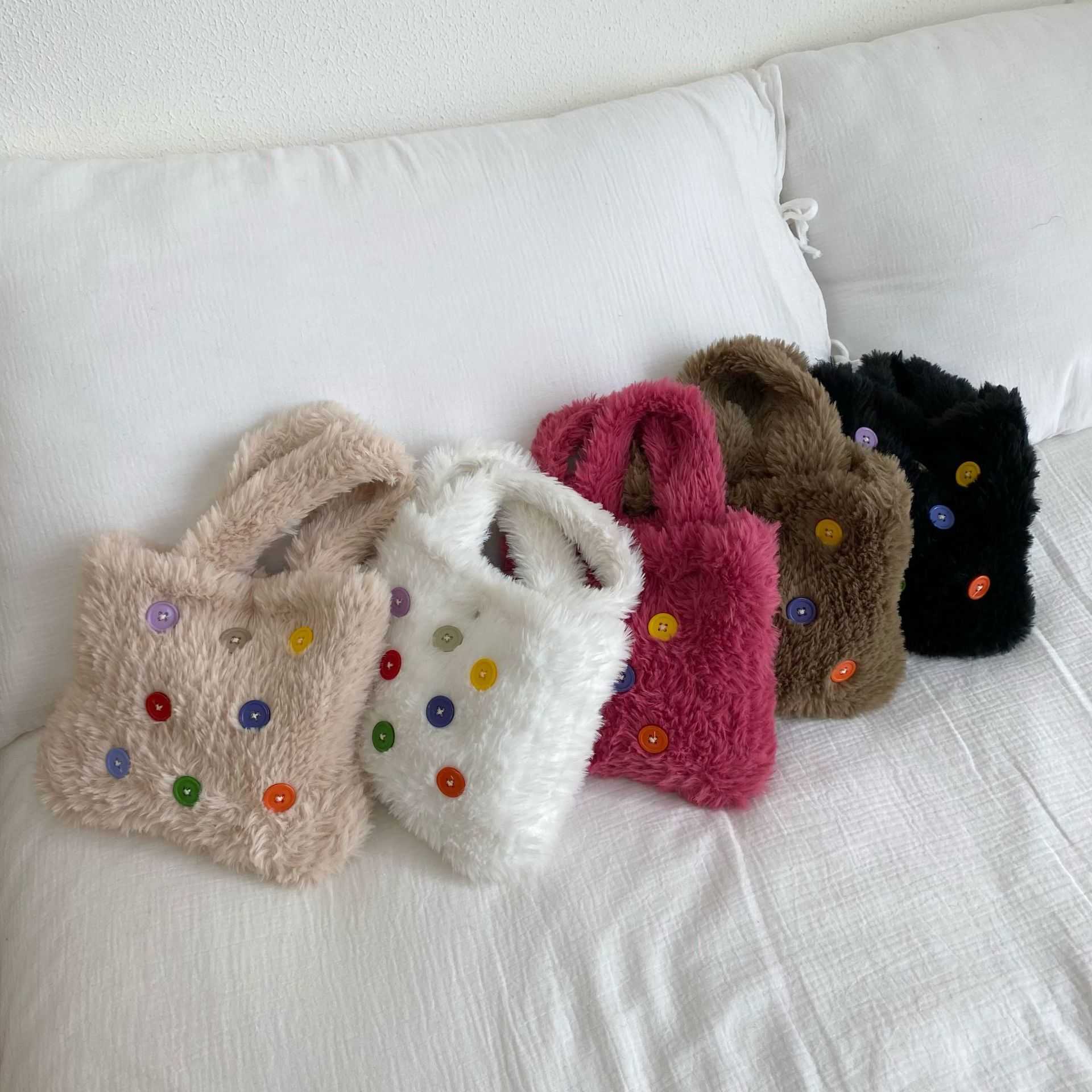 2023 new plush small handbag, female internet celebrity button, niche Korean version, minimalist temperament, hand-held bag 241120