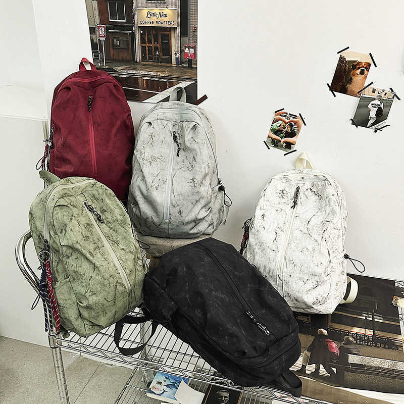 Backpack men's simple large capacity backpack women's leisure junior middle school students high school students schoolbag men 241120