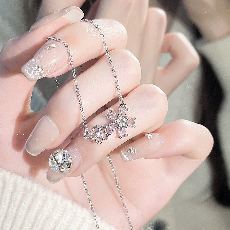 Elegant Small Fresh Style Women's Necklace Featuring Zircon Flowers & Stainless Steel Locket