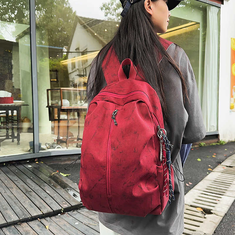 Backpack men's simple large capacity backpack women's leisure junior middle school students high school students schoolbag men 241120