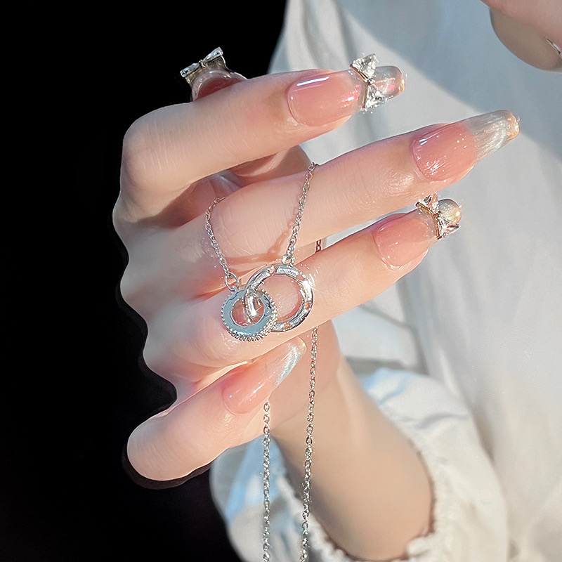 Trendy Love Symbol Hollow Out Necklace Featuring Dual Moebius Rings & Stainless Steel Chain