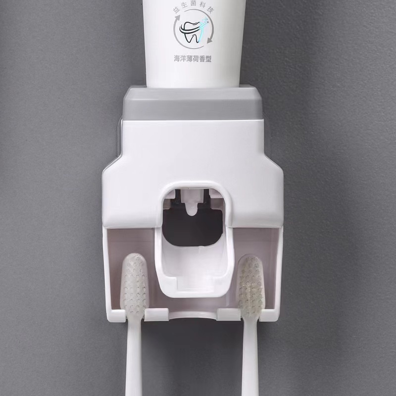 Explosive automatic toothpaste squeezer wall hanging perforation-free toothbrush holder