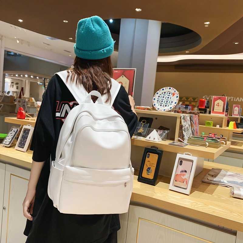 New solid color PU leather backpack with large capacity and versatile design for men, Korean version trendy brand casual backpack for female college s