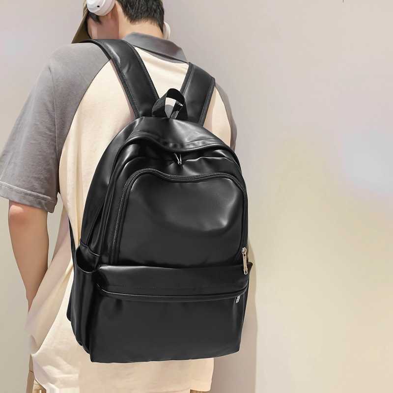 New solid color PU leather backpack with large capacity and versatile design for men, Korean version trendy brand casual backpack for female college s
