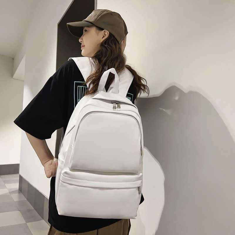 Large capacity and high-value PU stylish backpack for junior and senior high school 2024 new Korean style simple couple fashion travel bag