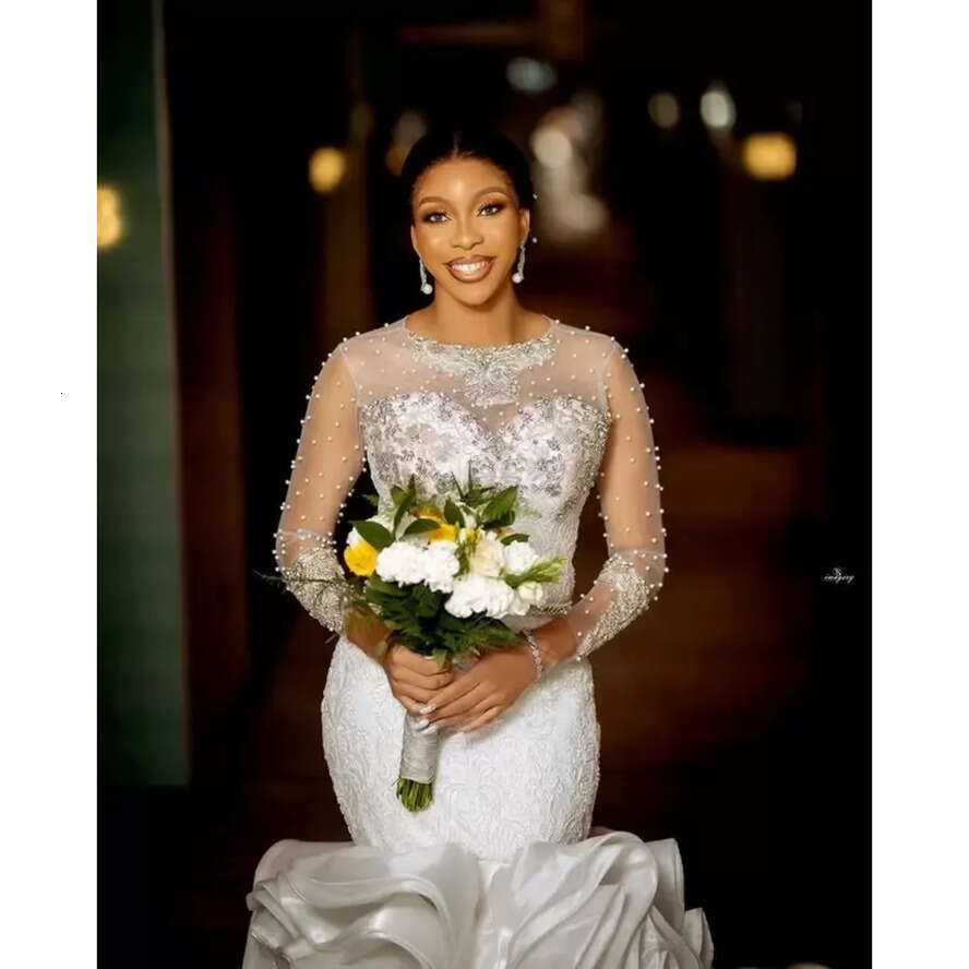 Plus Size Arabic Lace Crystals Urious Wedding Dresses Aso Ebi Sheer Neck Long Sleeves Pearls Beaded Tiers Ruffles Bridal Gowns