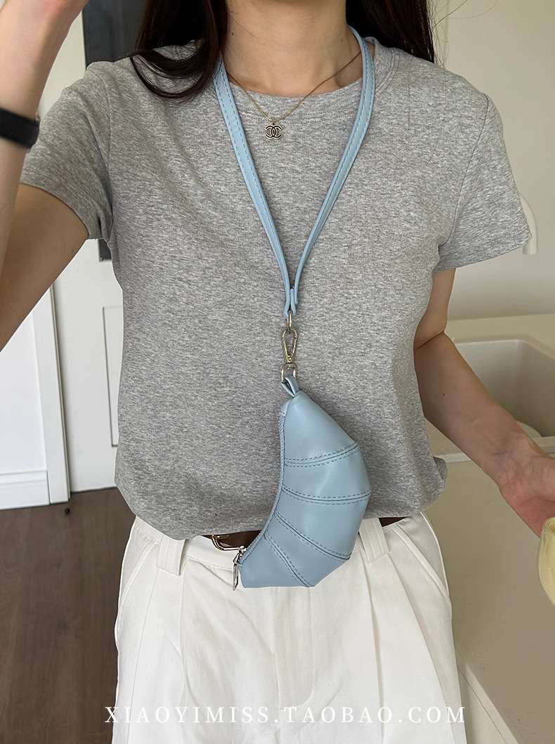 2025S designer neck hanging small change key cute cow horn niche mini bag concave shape crossbody lipstick headphone bag