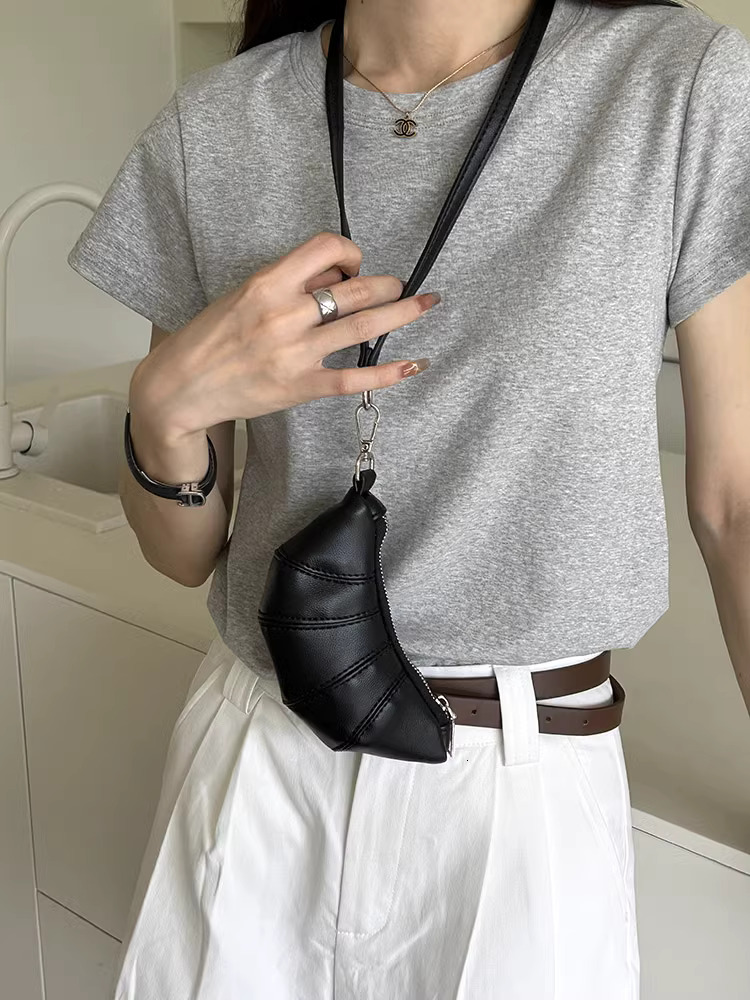 2025S designer neck hanging small change key cute cow horn niche mini bag concave shape crossbody lipstick headphone bag