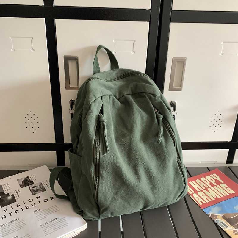 Korean casual niche canvas backpack 2024 new female fashion versatile student backpack simple and lightweight backpack