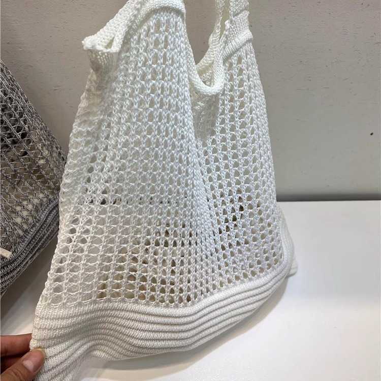 New niche design highend shoulder bag, armpit woven bag, women's autumn hollow hole knitted fabric bag
