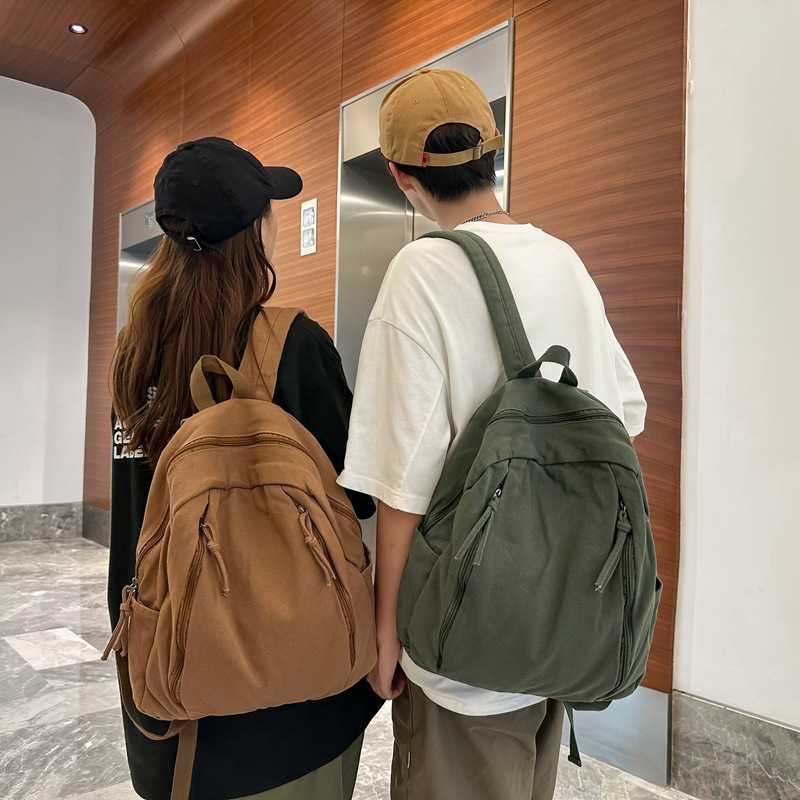 Korean casual niche canvas backpack 2024 new female fashion versatile student backpack simple and lightweight backpack