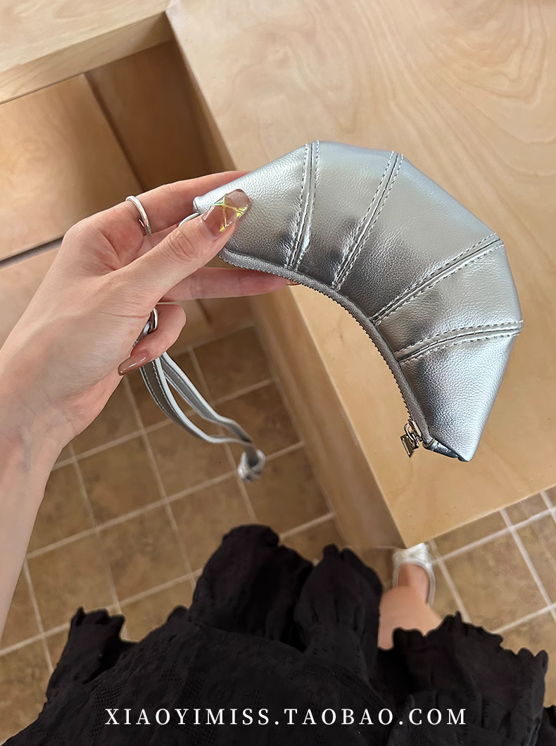 2025S designer neck hanging small change key cute cow horn niche mini bag concave shape crossbody lipstick headphone bag