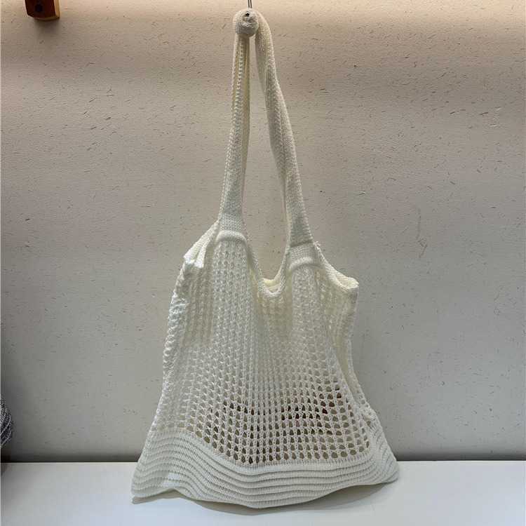 New niche design highend shoulder bag, armpit woven bag, women's autumn hollow hole knitted fabric bag