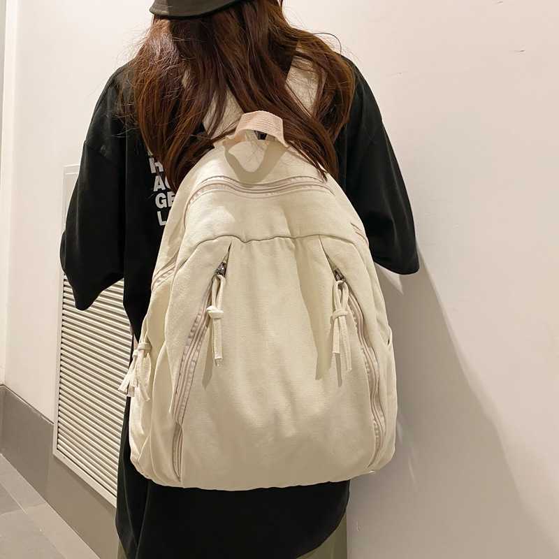 Korean casual niche canvas backpack 2024 new female fashion versatile student backpack simple and lightweight backpack
