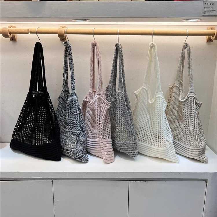 New niche design highend shoulder bag, armpit woven bag, women's autumn hollow hole knitted fabric bag