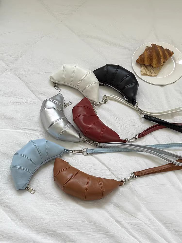 2025S designer neck hanging small change key cute cow horn niche mini bag concave shape crossbody lipstick headphone bag