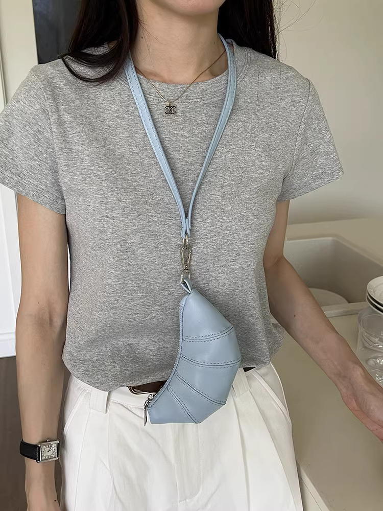 2025S designer neck hanging small change key cute cow horn niche mini bag concave shape crossbody lipstick headphone bag