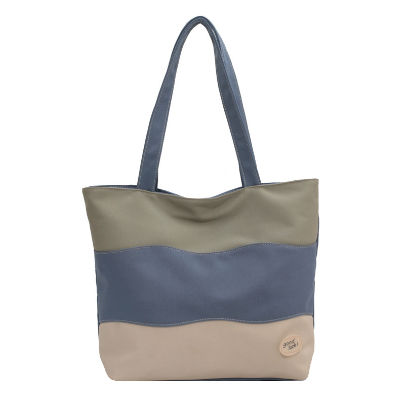 2025 new Women's new textured tri color spliced hand-held canvas with large capacity women's tote shoulder bag