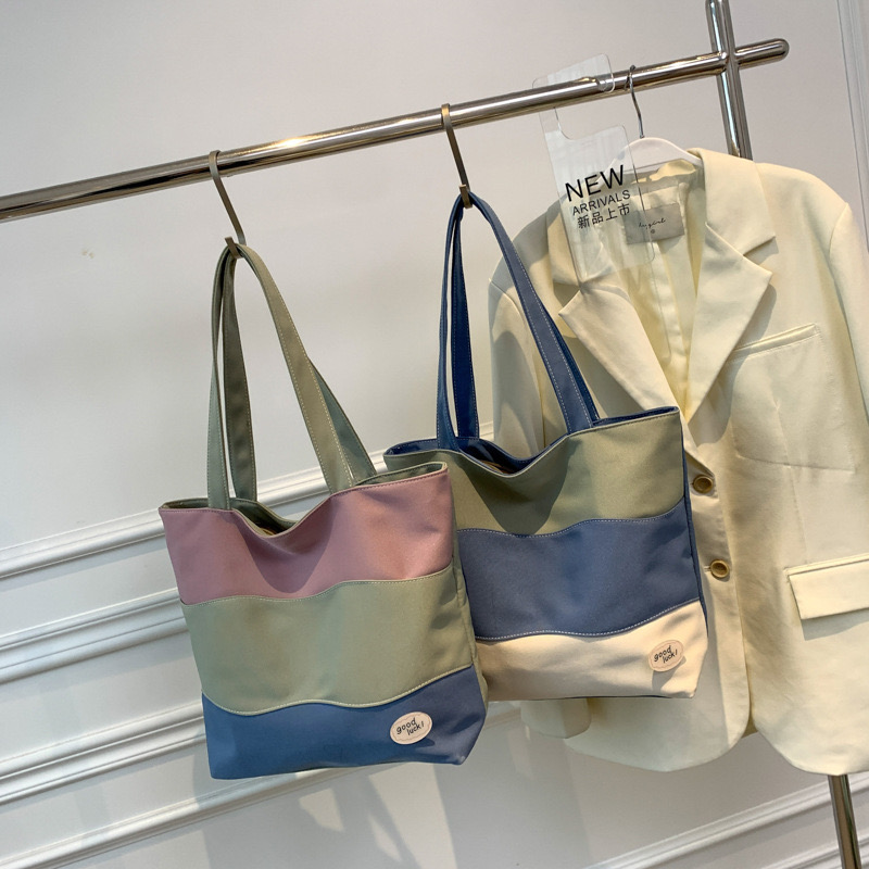 2025 new Women's new textured tri color spliced hand-held canvas with large capacity women's tote shoulder bag