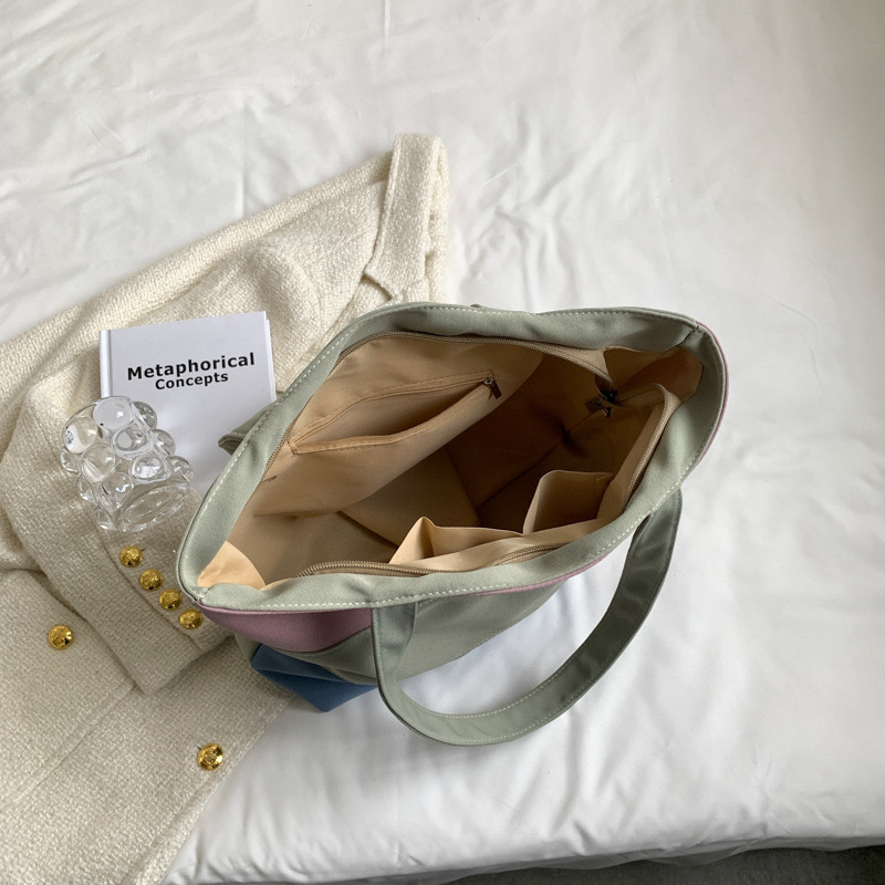 2025 new Women's new textured tri color spliced hand-held canvas with large capacity women's tote shoulder bag