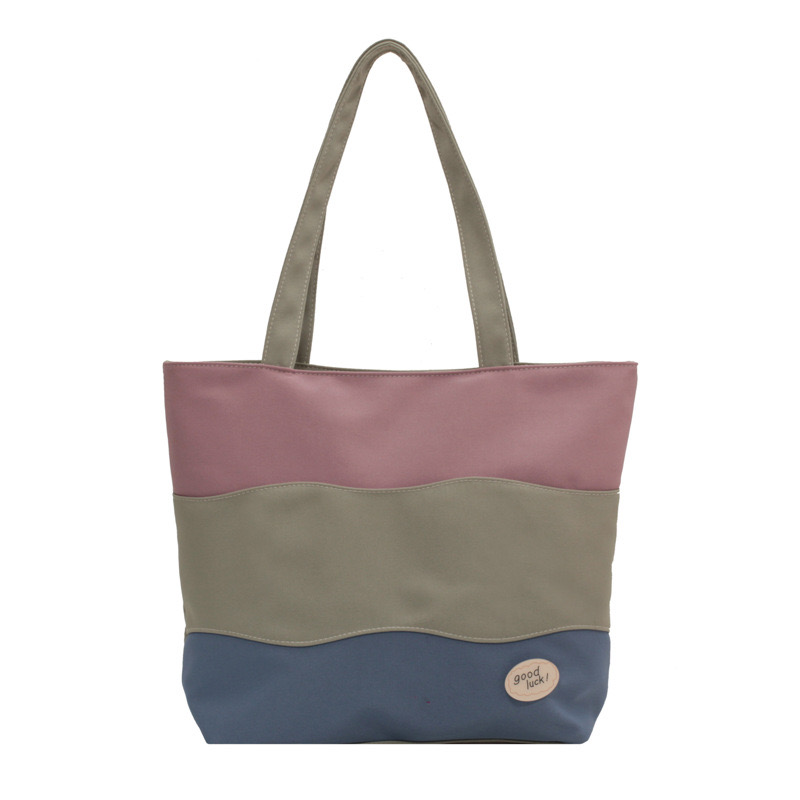 2025 new Women's new textured tri color spliced hand-held canvas with large capacity women's tote shoulder bag