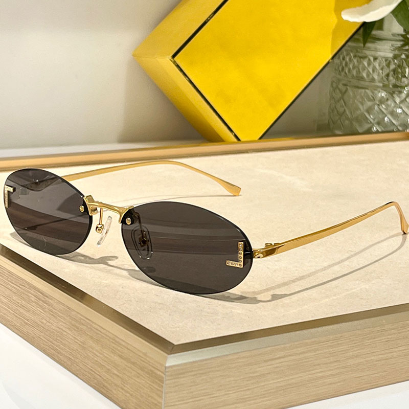 Fashion Womens oval shaped first crystal glasses 4075 designer 25SS New style gold frameless metal sunglasses outdoor UV400 Mens Womens sunglasses