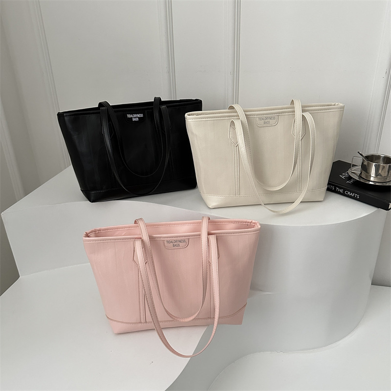 Korean version 2025S designer new fashionable atmospheric and simple tote women large capacity splicing single shoulder hand-held commuting bag women