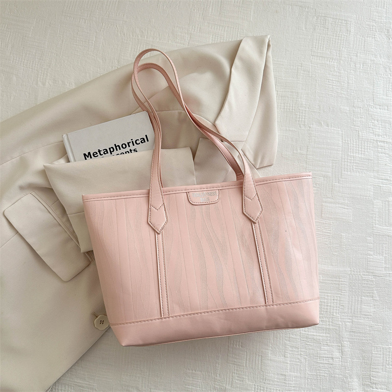 Korean version 2025S designer new fashionable atmospheric and simple tote women large capacity splicing single shoulder hand-held commuting bag women