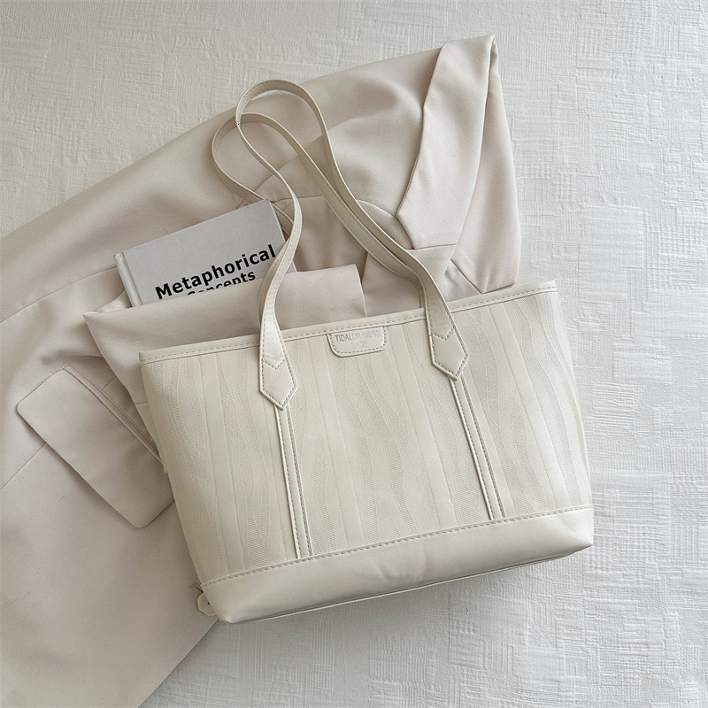 Korean version 2025S designer new fashionable atmospheric and simple tote women large capacity splicing single shoulder hand-held commuting bag women