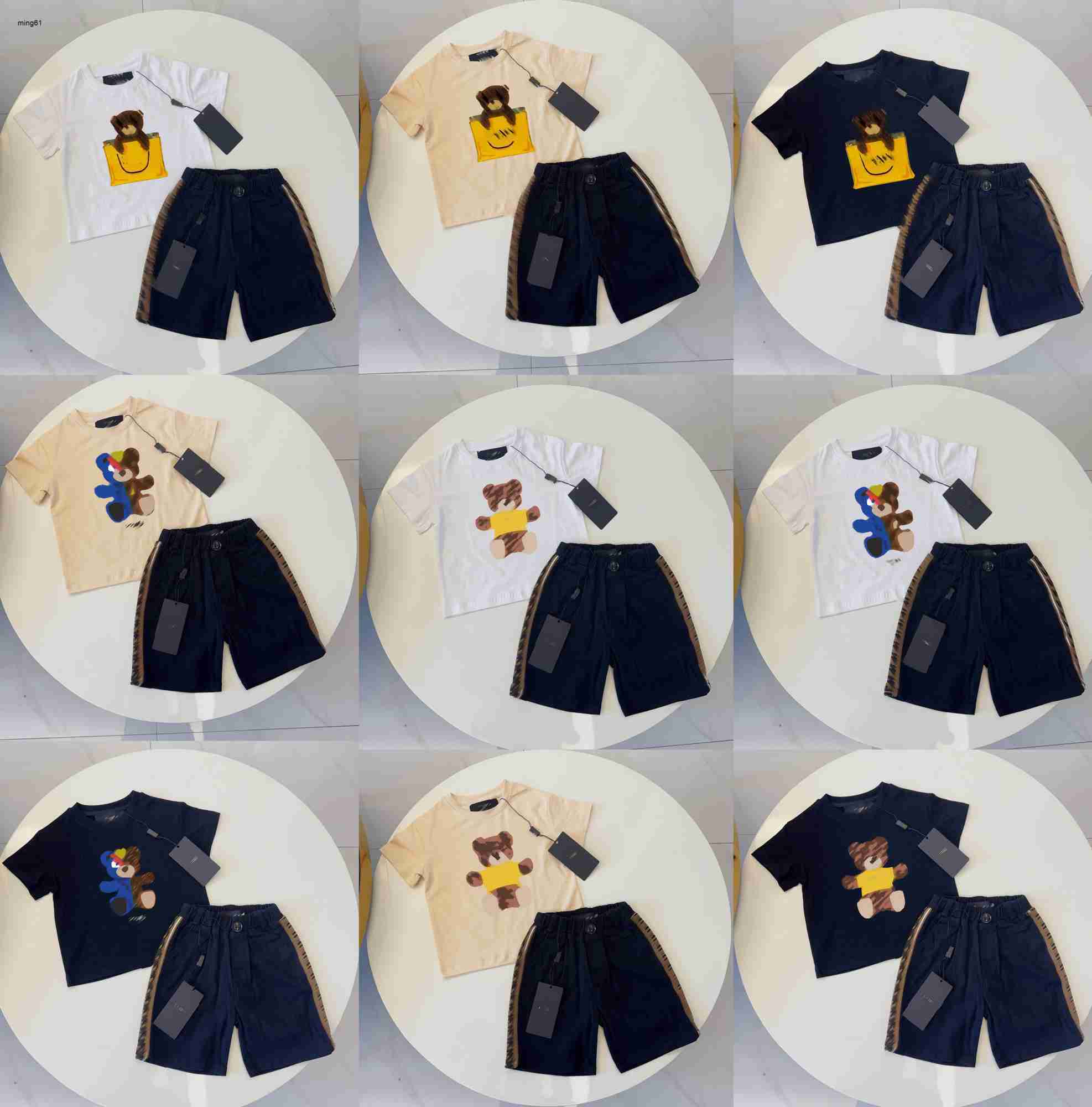 Brand kids T-shirts summer boys girls tracksuits Size 100-150 baby short sleeves and Grid letter printed shorts Jan20