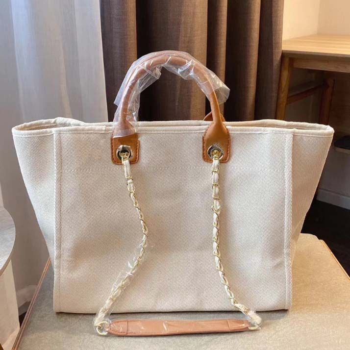 10A Luxury womens designer tote bag Classic Capacity High Quality Fashion Versatile Pearl dhgate 38cm Large Canvas leather shoulder Shopping Bags high quality